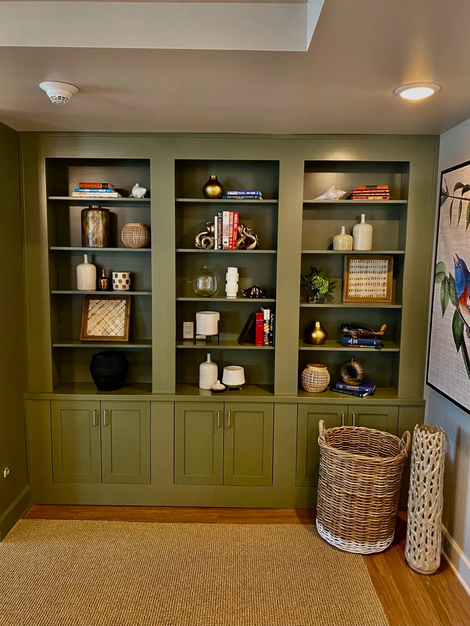 Olive green custom built-in cabinetry with shelving